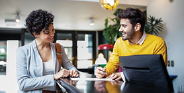 2 people collaborating at table